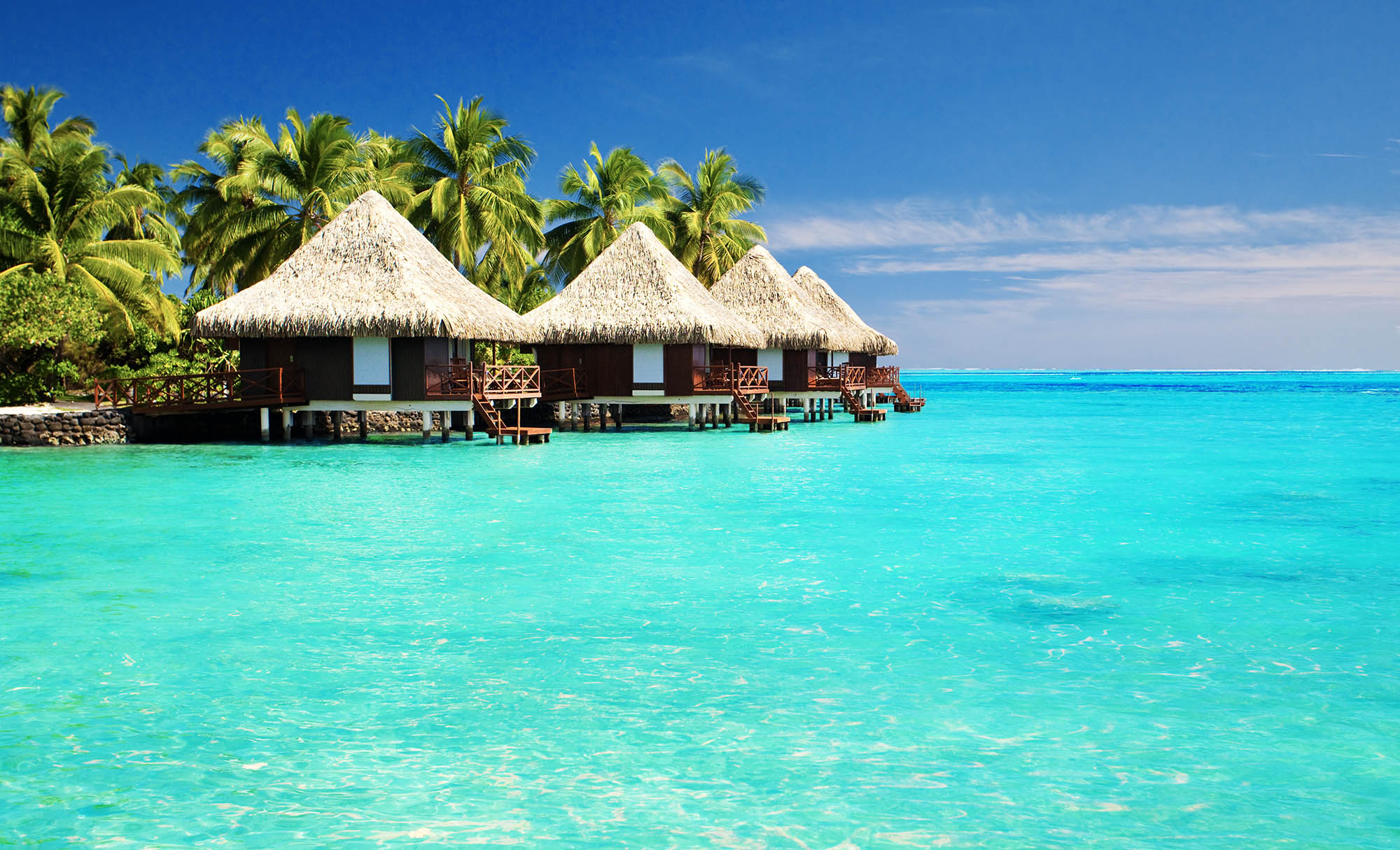 tropical huts on water